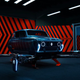 A personal flying machine made using the shell of a vintage Renault 4 car.